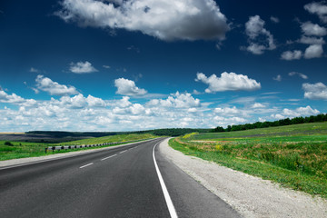 Empty asphalt road at daytime. Beautiful nature landscape