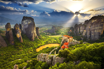 Greece. Meteora - incredible sandstone rock formations. The Holly Monastery of Rousanou and St. Nikolaos Anapafsas Monastery in the background. The Meteora area is on UNESCO World Heritage List - obrazy, fototapety, plakaty