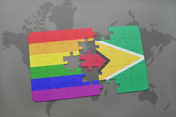 puzzle with the national flag of guyana and gay rainbow flag on a world map background.