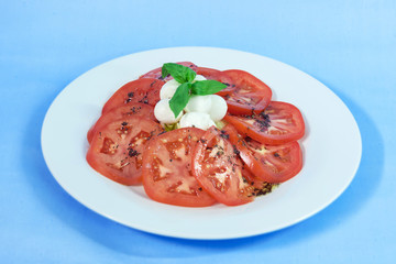 Modern food on a white plate and blue background