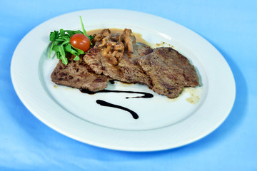 Modern food on a white plate and blue background