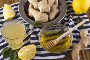 Cup of Ginger tea with lemon and honey.