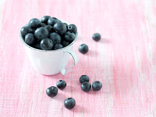 blueberries on wooden surface