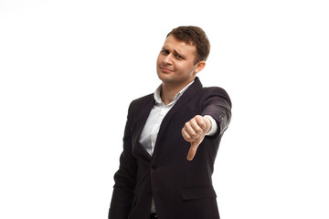 Handsome businessman showing thumb down