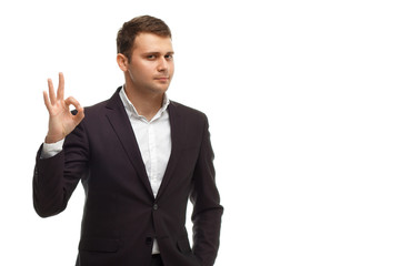 Handsome businessman shows okay gesture