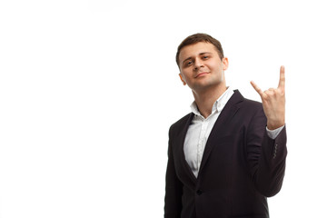 Handsome businessman shows rock gesture