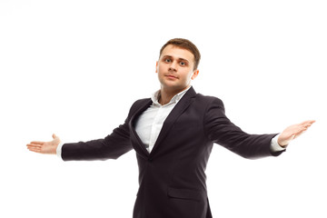 Handsome businessman spreads his arms