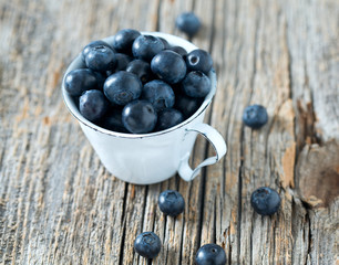 blueberries on wooden surface