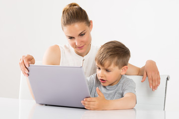 Mother And Son Using Laptop