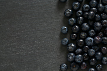blueberries on stone board