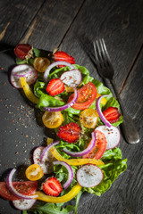 Fototapeta na wymiar Fresh vegetable salad on a slate board