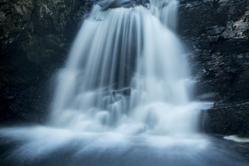 Fototapeta na wymiar Silky water of Tankerhoosen Falls on the Hockanum River in Rockville, Connecticut.