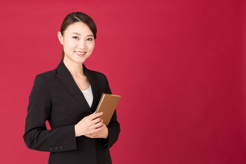 asian businesswoman isolated on red background