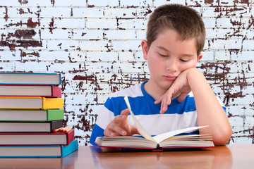Elementary schoolboy focusing on his studies © Ozgur Coskun