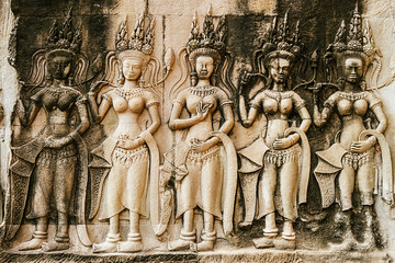 Apsara sculpture on the wall of Angkor Wat, Seam Reap, Cambodia. - obrazy, fototapety, plakaty