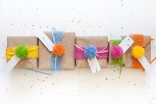 Preparation for the holiday. Gifts wrapped in kraft paper. Confe