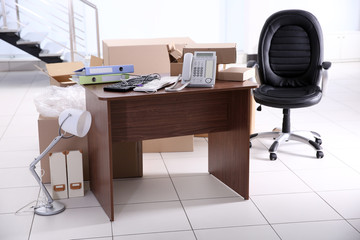 Move concept. Unpacking cardboard boxes in a new office