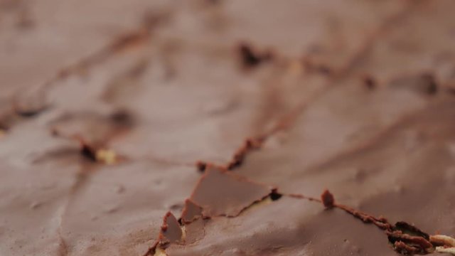 Chocolate cake smaller pieces in baking pan slow panning 4K 3840X2160 UHD video - Tasty chocolate glaze on cake surface 4K 2160p UHD footage 