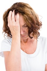 Fototapeta premium Upset mature woman with head in hand