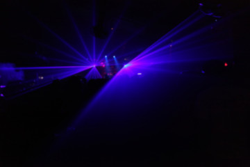 violet concert light show on stage in pub