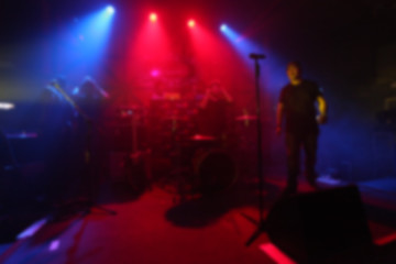 Fototapeta na wymiar Blurred Singer band on stage in pub 