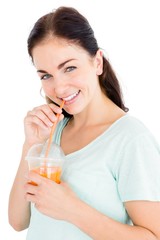 Portrait of smiling woman having fruit juice