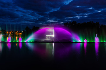 Night magic show of fountains on the central waterfront Roshen