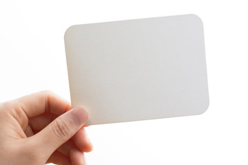 Obraz premium woman's hand holding white blank paper