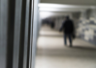 Vertical left aligned wall with man walking on the left backgrou