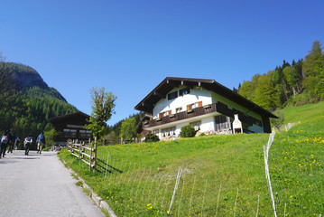 Fototapeta premium Generic bavarian house with green lawn