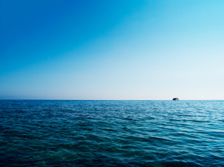 Horizontal blue ocean ship on horizon background - Powered by Adobe