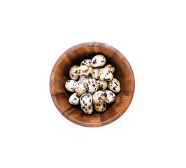 White bowl with fresh quail eggs on white background