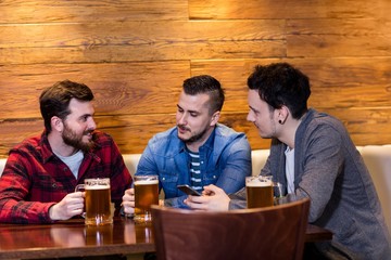 Friends enjoying beer at restaurant