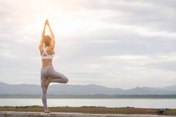 Asia woman doing yoga fitness exercise