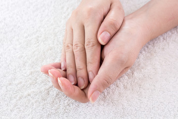 Beautiful female hands on fabric background