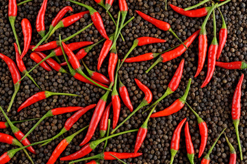 red peppers on black peppercorns