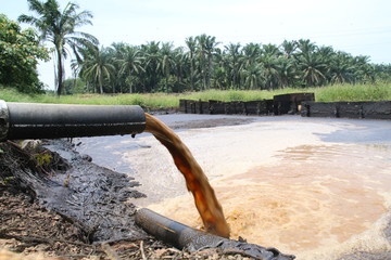 Palm Oil Mill Effluent (POME) wastewater being discharged