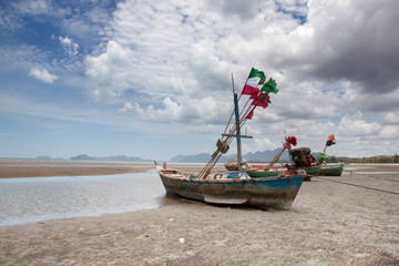 Fototapeta na wymiar homegrown fishing boats mooring on beach