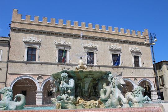 View of the Maggiore Fountain in the square of the people, with Palazzo Ducale as background (Pesaro, Marche, Italy)
