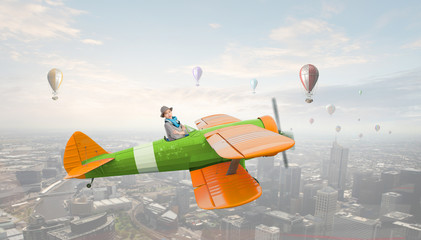 Girl flying old plane . Mixed media