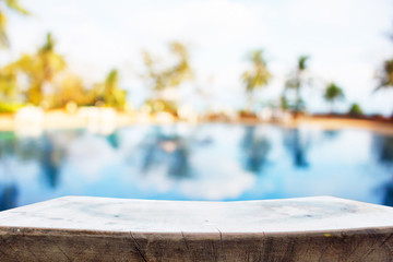 Wood Table Top of The Background and Pool