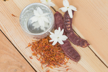 water in silver bowl with Jasmine Safflower and Acacia concinna, Thailand Songkarn festival decoration concept.