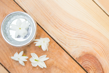 water in silver bowl with jasmine white flower, Thailand Songkarn