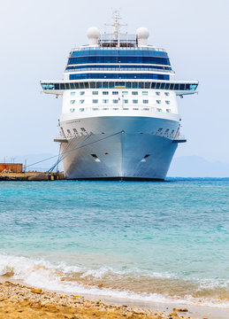 cruise ship at the berth in the port of Rhodes Greece. Front view from the shore