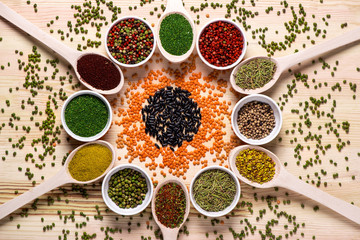 Spices  in spoons on wooden table