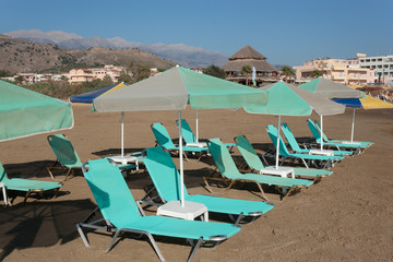 Rows of sun loungers and parasols