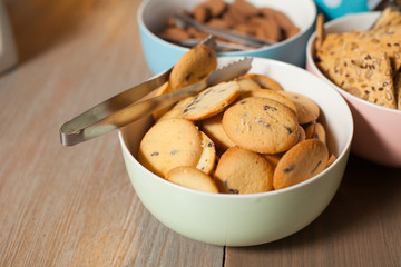 Plates with cookies on table