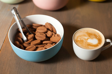 On the table cup and cookies
