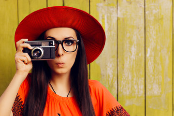 Funny Girl with Retro Photo Camera and Red Sun Hat