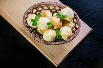 Coconut cookies in a basket with mint, a tasty dessert